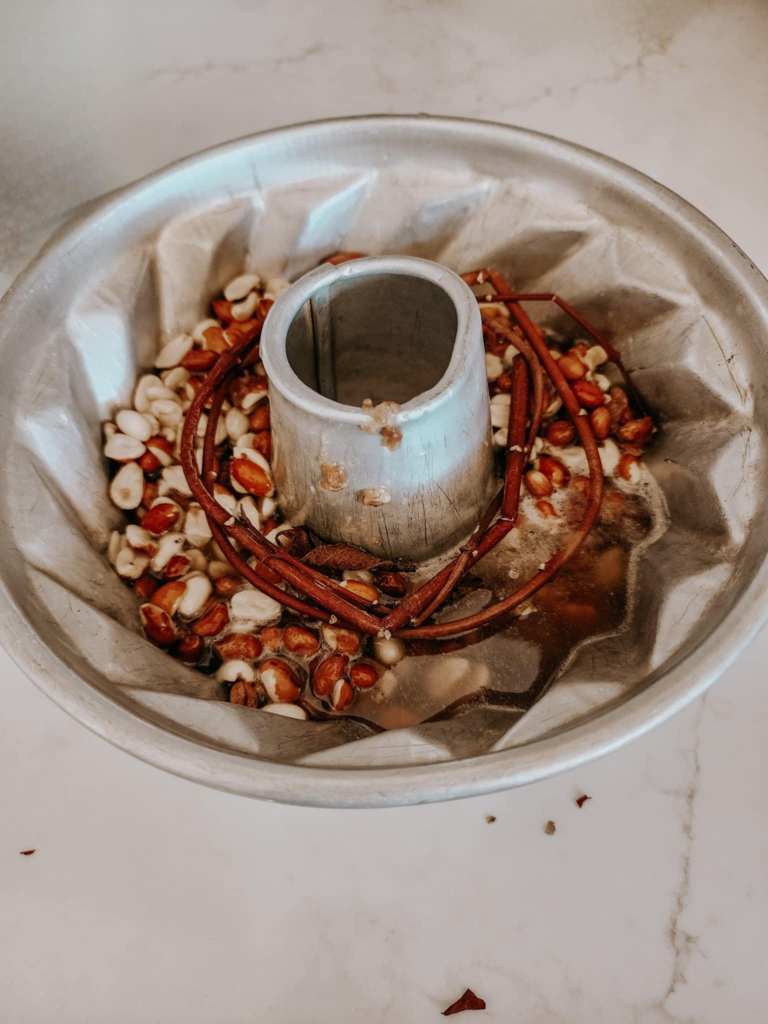 A ring of twigs in the center of the birdseed wreath keeps it from cracking in half. 