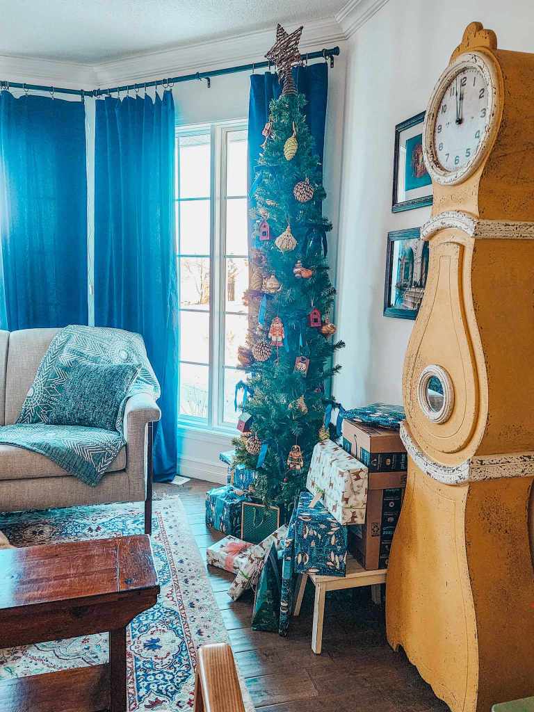 A pencil tree, mora clock, and cosy living room set up for the holidays.