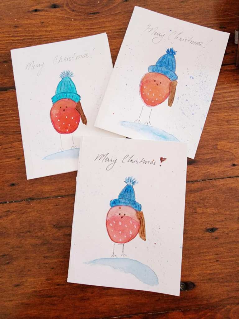 A funny little watercolour strawberry shaped bird Christmas card. 