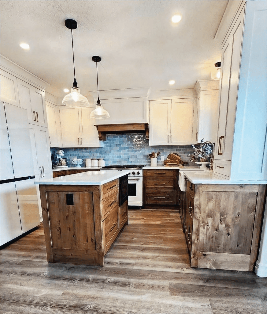 A kitchen with white upper cabinets and alder lower cabinets. 