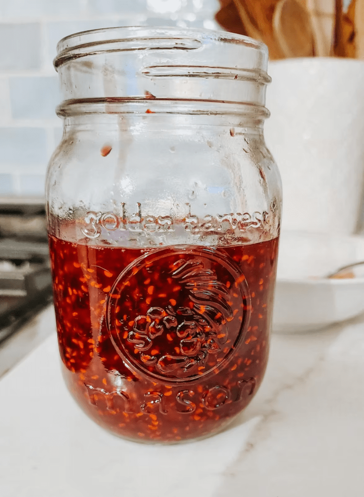 The pretty red of freshly made homemade raspberry jam. 