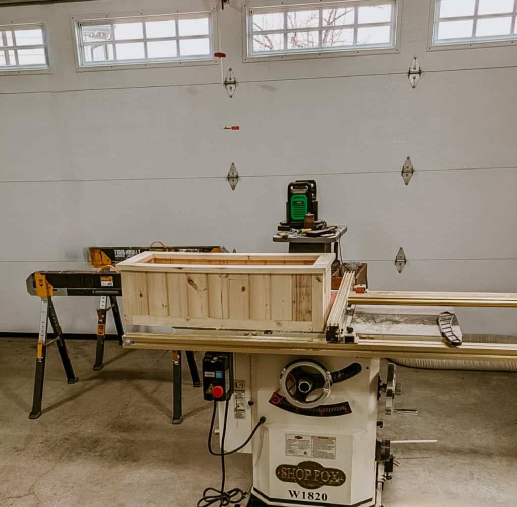 A new window box being built out of tongue and groove. 