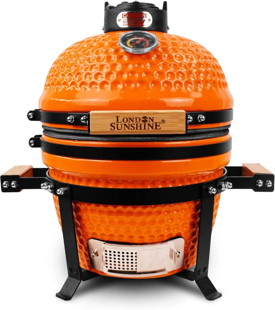 An orange, egg-shaped barbecue grill with a temperature gauge and wooden accents.