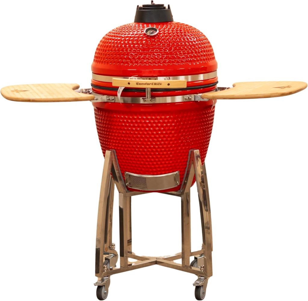 A red ceramic egg-shaped barbecue grill on a metal stand with wooden side shelves.