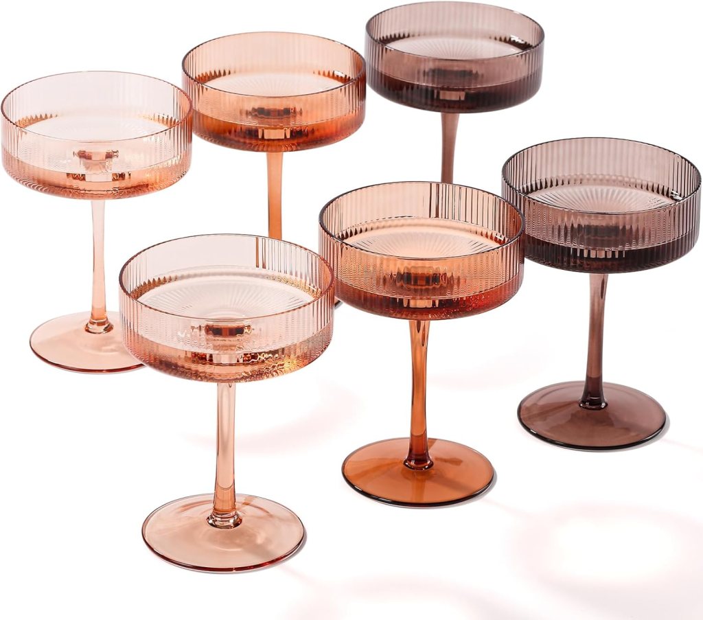Set of six stylish and modern glass dessert or cocktail cups in varying shades of amber and brown, featuring ribbed texture.