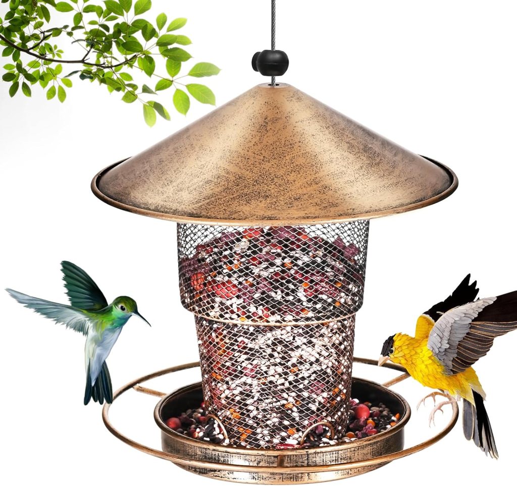 A decorative bird feeder with a bronze finish, featuring a mesh container filled with seeds, surrounded by greenery and two colorful birds: a hummingbird and a yellow bird.