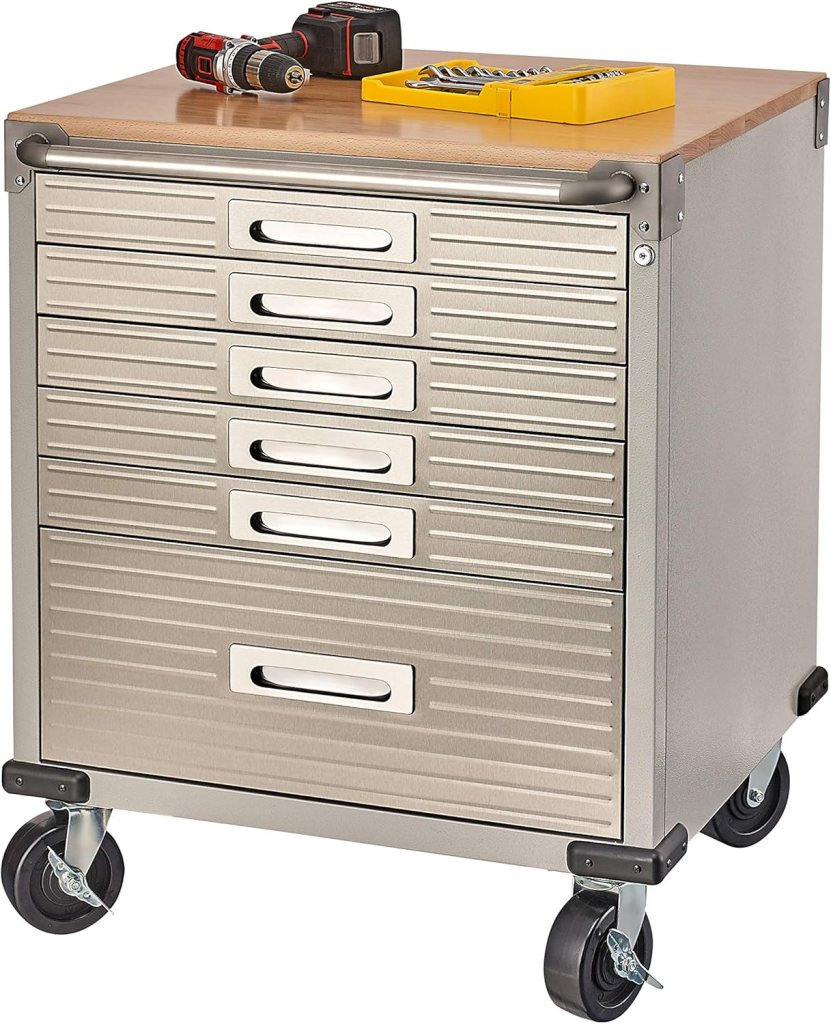 Metal tool storage cabinet with multiple drawers and a wooden top, equipped with a drill and a set of tools.
