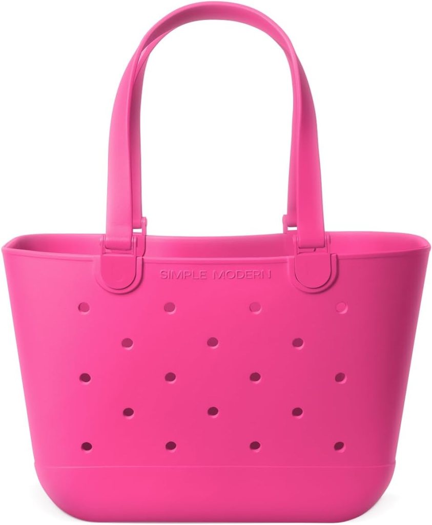 Bright pink rubber tote bag with perforated design and sturdy handles, ideal for beach outings or summer activities.