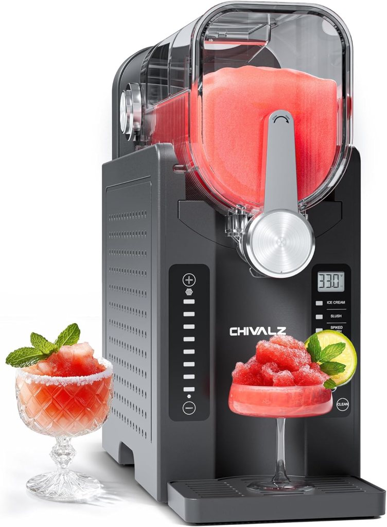 A frozen drink maker in black, producing a slushy-style beverage with a digital display, serving a vibrant red drink garnished with mint in two glasses.