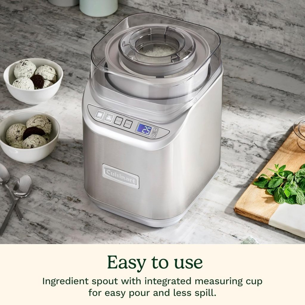 Cuisinart ice cream maker on a kitchen countertop with bowls of ice cream in the background.