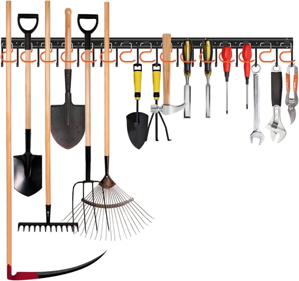 A collection of gardening tools organized on a wall-mounted rack, including shovels, rakes, and various hand tools.