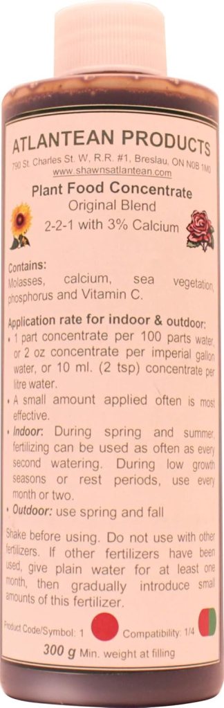 Bottle of Atlantean Products Plant Food Concentrate with a label detailing ingredients, usage instructions, and application rates.