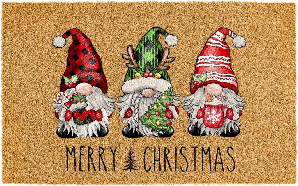 A festive doormat featuring three colorful gnomes, each wearing unique hats and holding holiday-themed decorations, with the text 'MERRY CHRISTMAS' below.