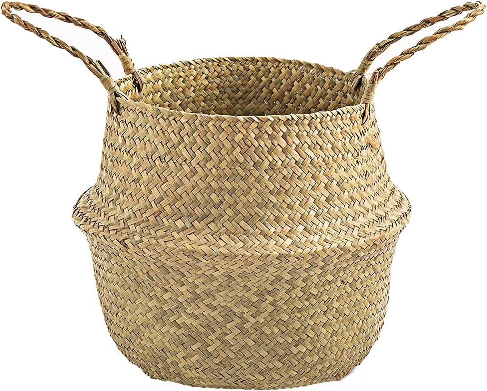 A woven natural straw basket with two handles, featuring a wide opening and tapering design.