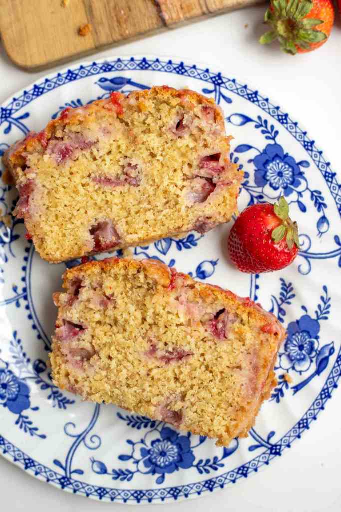 A sourdough loaf cake with strawberries in it.